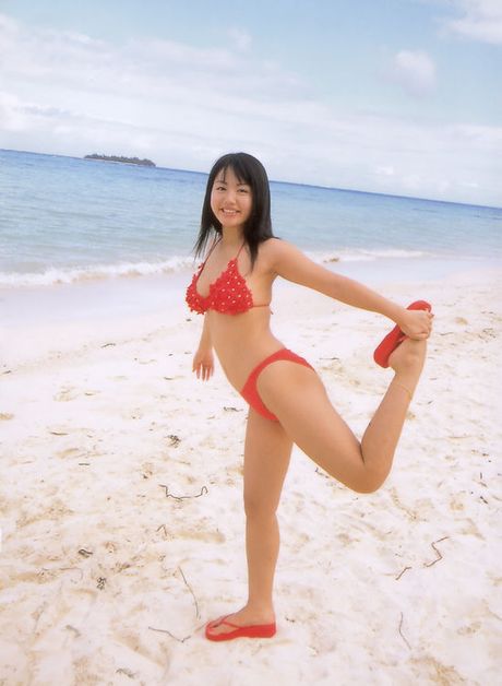 Petite asian doll teasing in her skimpy bikini in the bathtub