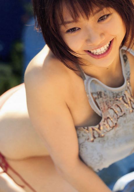 Busty asian babe is erotically beautiful in her printed bikini