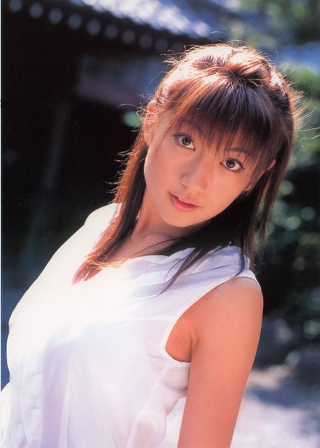 Sexy asian diva poses in a sizzling skin tight hot pink dress