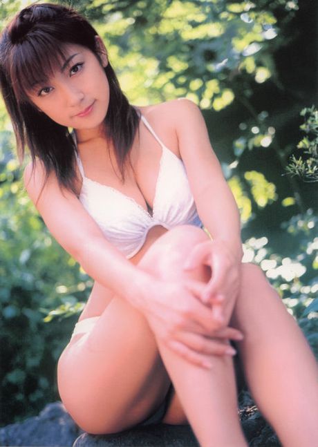 Sexy asian diva poses in a sizzling skin tight hot pink dress