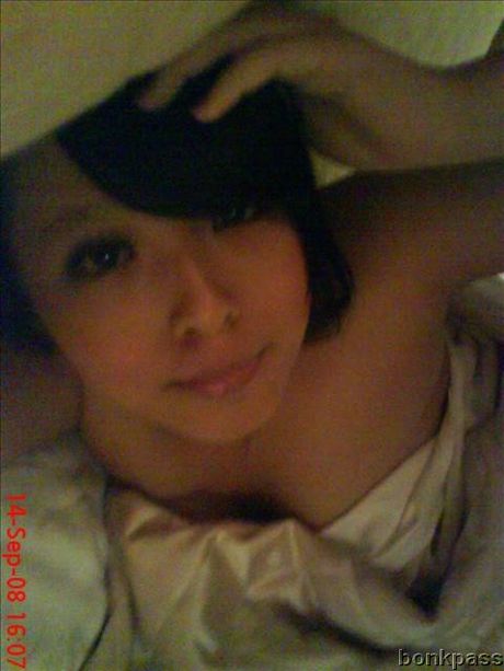 Very pretty Chinese girl takes picture in dim area