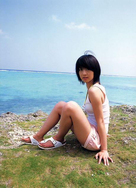 Petite gravure beauty is radiant and sexy in her white bikini