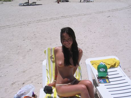 Super gorgeous Asian girl having fun in the beach