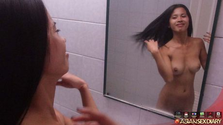 Skinny Asian teen Daisy reveals her tiny tits and toys her pussy