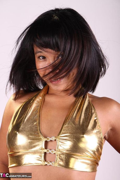 Asian babe Melissa shows her hot booty and tits in a solo striptease