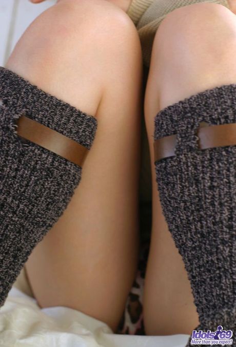 Sexy Asian babe Hikaru Koto strips and shows her hairy pussy up close