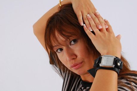 Japanese babe strips and shows her small tits and pussy