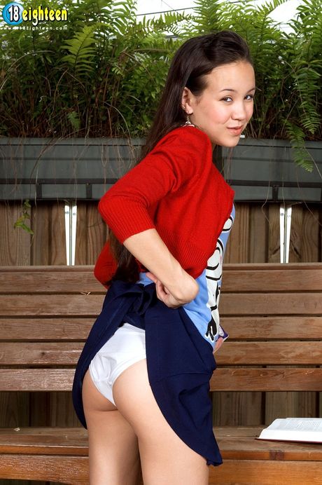 Asian teen Amai Liu toys her pussy with a dildo in the backyard