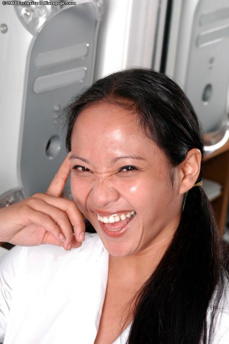 Rangy oriental dark-haired youthful Loni in fancy skirt exposes big titties and pussy