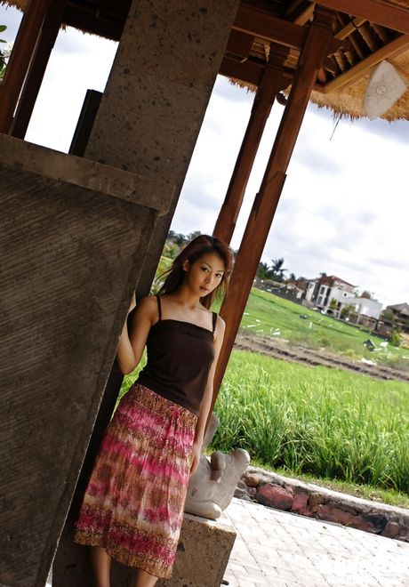 Slender japanese babe Honoka in skirt denudes small tits and spreads her legs